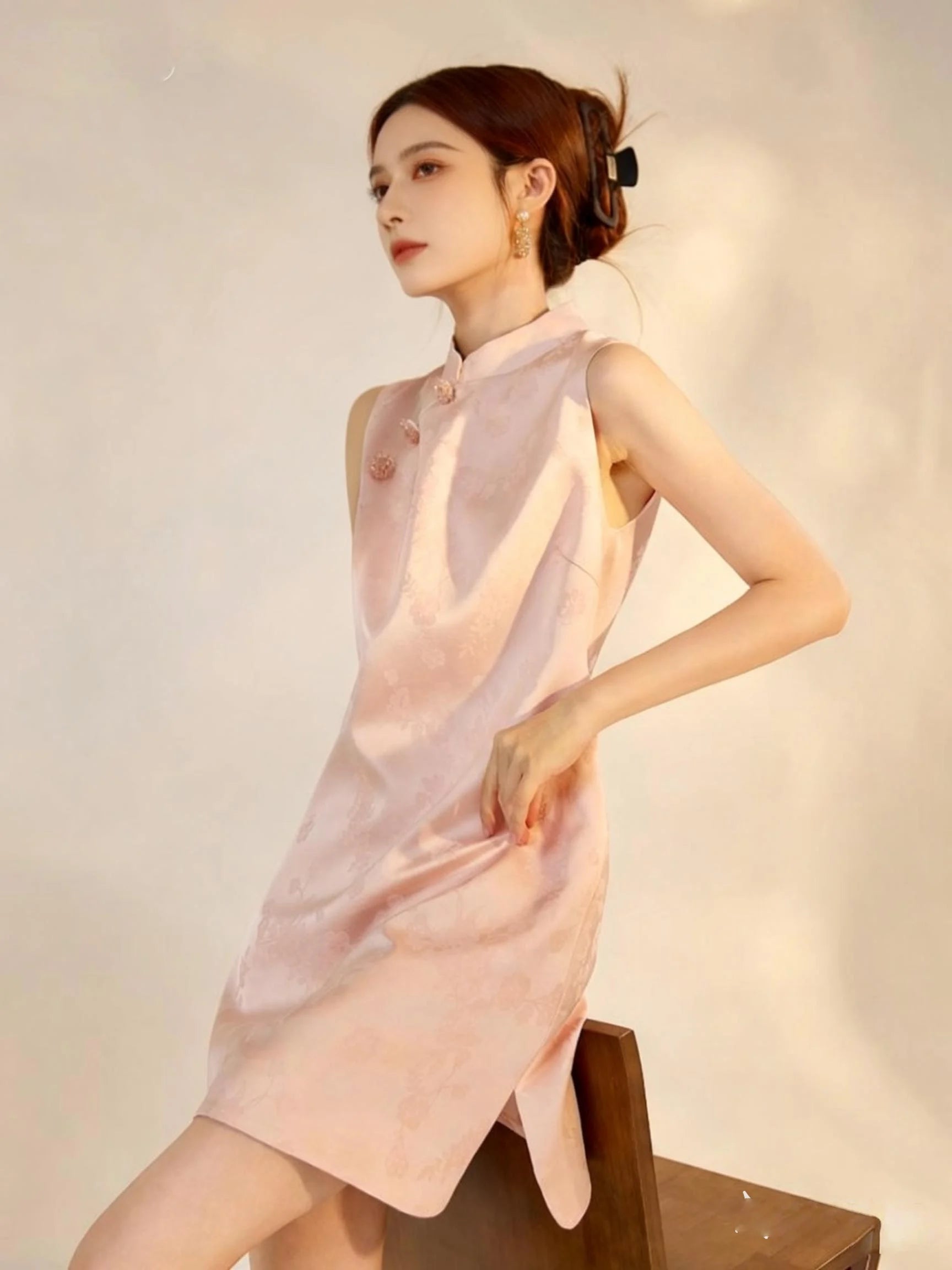 Woman wearingNew Chinese Style-Modern Pastel Pink Sleeveless A-Line Mini cheongsam dress against a plain background