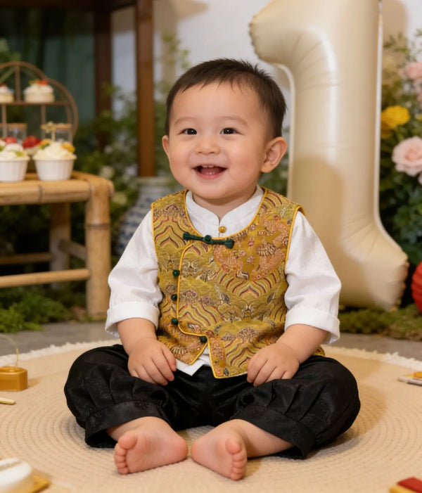 Child in a formal New Chinese Style Baby Boy Traditional Tang Suit Dragon Vest Set outfit sitting on the floor with a large number '1' in the background