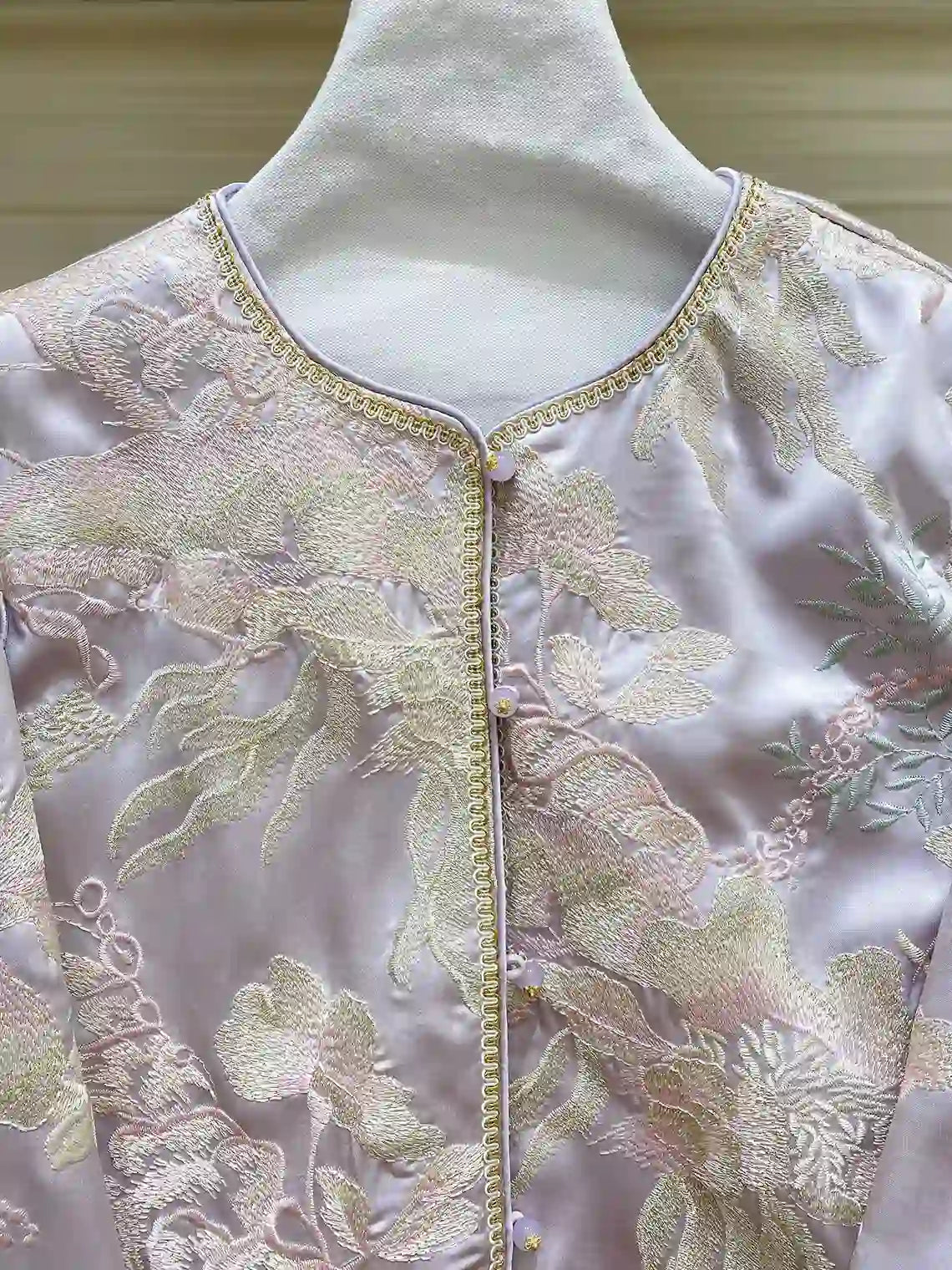 New Chinese Style Lilac Mist Embroidered Jacket   on a mannequin with gold thread details