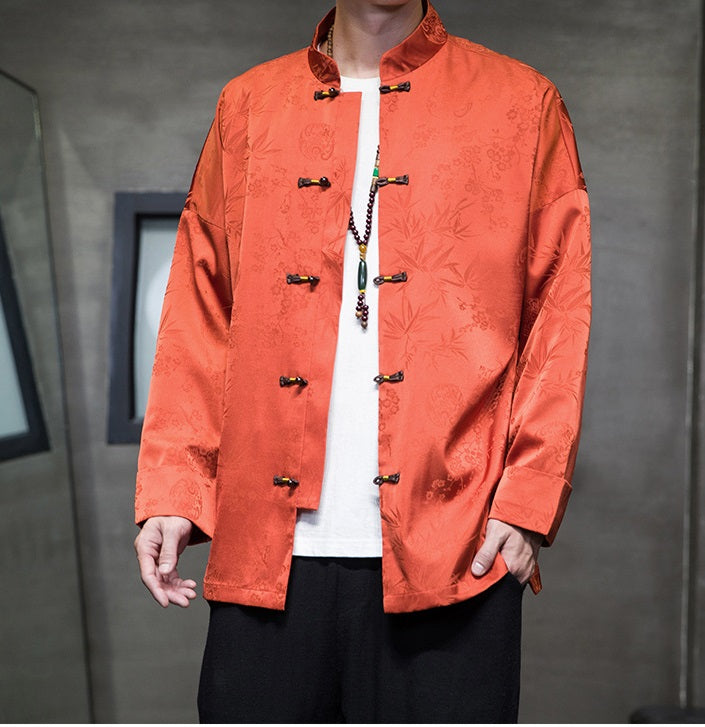 A chinese men in Orange Chinese Jacquard  Tang Jacket with frog buttons open