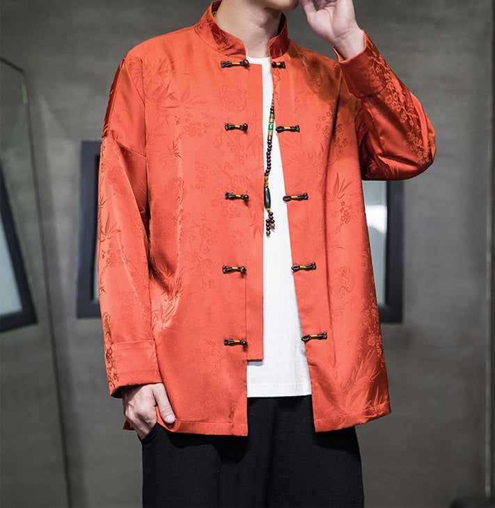 A chinese men in Orange Chinese Jacquard  Tang Jacket with frog buttons open