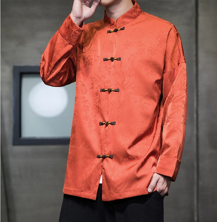 A chinese men in Orange Chinese Jacquard  Tang Jacket with frog buttons closed