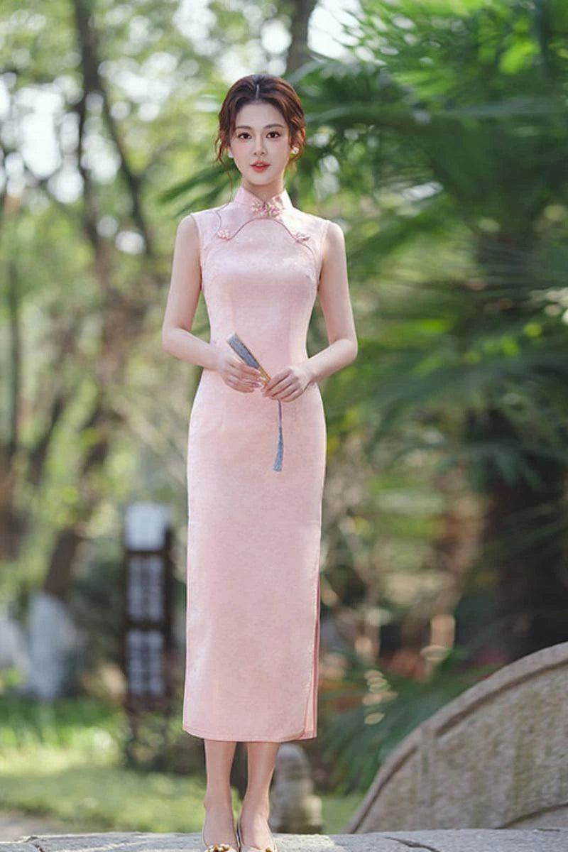Woman in a Pastel Pink Sleeveless Modern Jacquard Qipao  dress standing outdoors with greenery in the background