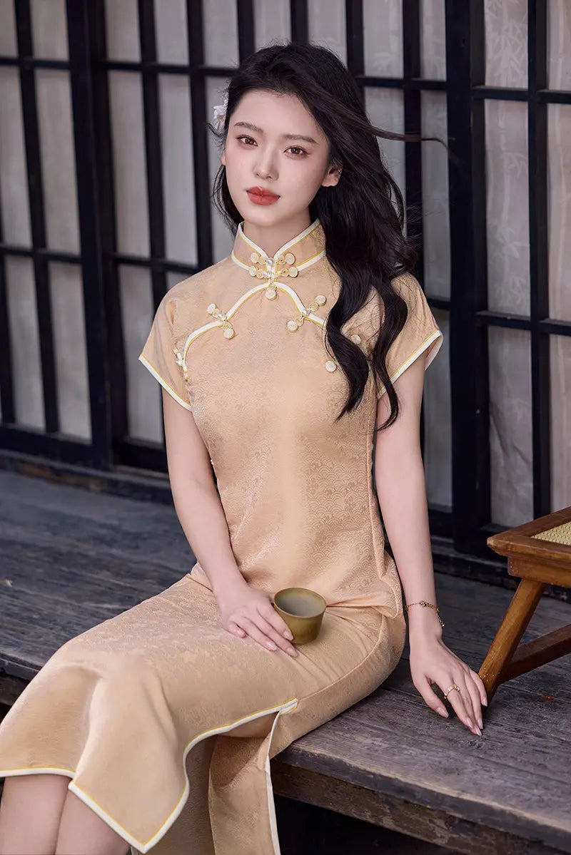 Woman in a Peach traditional  Song Brocade Full-Opening  Qipao Dress  sitting on a wooden bench.