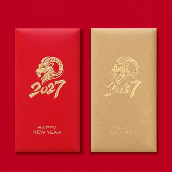 Two red envelopes for the Year of the Ram 2027, one with metallic gold foil ram head and '2027' text, and the other in matte gold with the same gold foil design, set against a solid red background.
