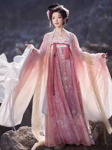 Person wearing a traditional Pink Embroidered Flowing Tang Dynasty Hanfu Dress  with a scenic background