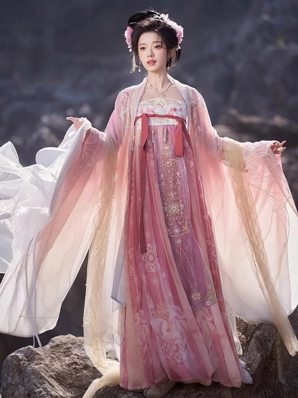 Person wearing a traditional Pink Embroidered Flowing Tang Dynasty Hanfu Dress  with a scenic background