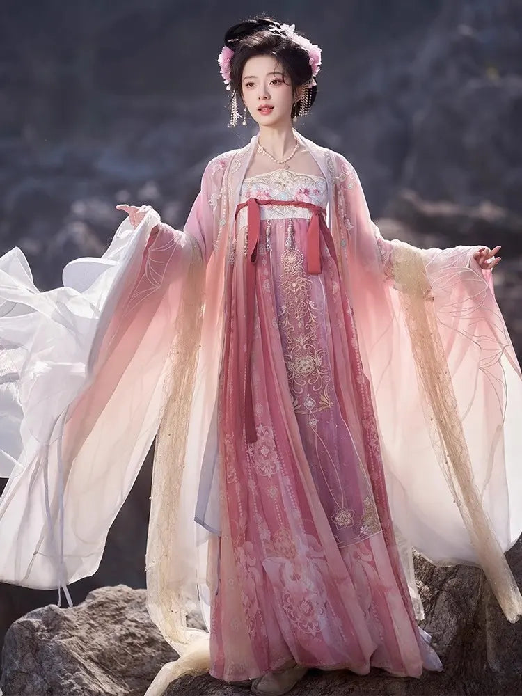 Person wearing a traditional Pink Embroidered Flowing Tang Dynasty Hanfu Dress  with a scenic background