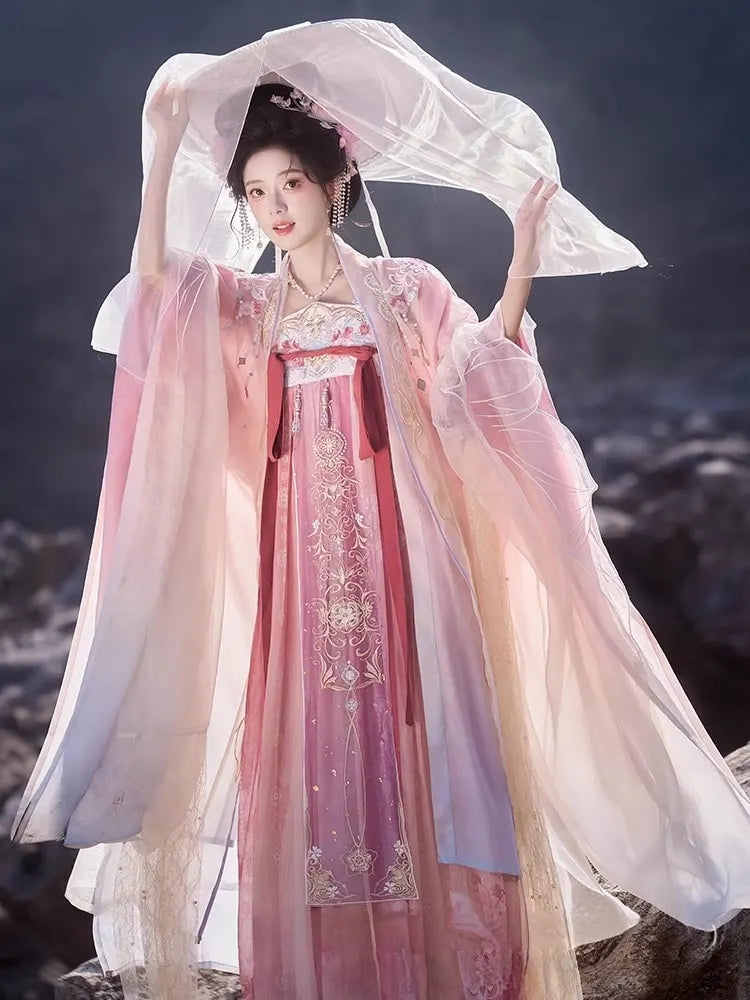 Person wearing a traditional Pink Embroidered Flowing Tang Dynasty Hanfu Dress  with a blurred natural background