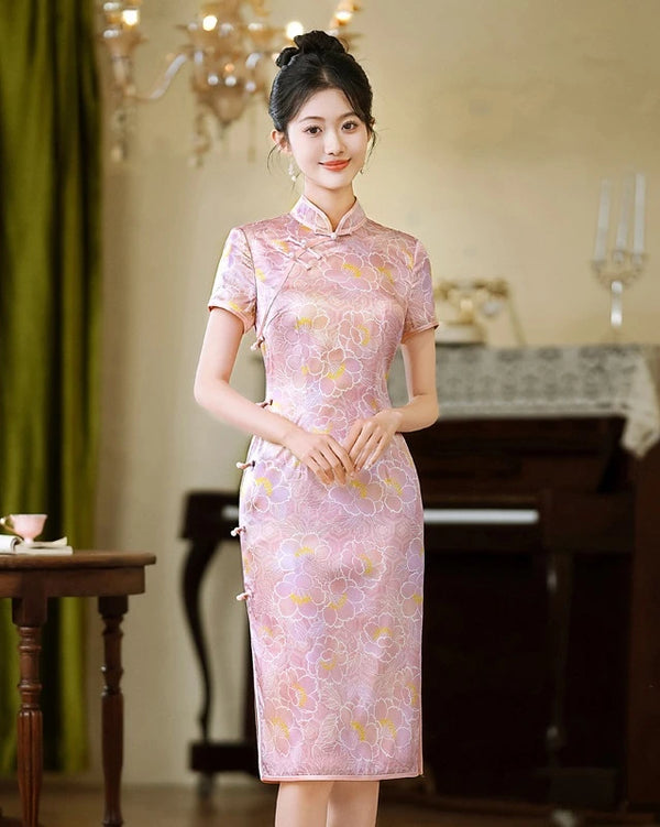 Woman wearing a traditional Chinese Pink Floral Mullbury Silk Short Sleeves Qipao Dress  in an elegant room setting.