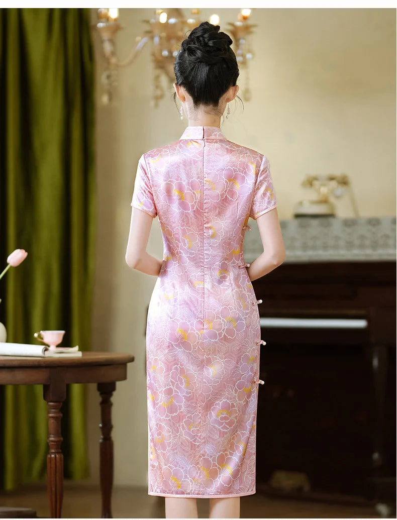 Woman wearing a Pink Floral Mullbury Silk Short Sleeves Qipao Dress in an indoor setting