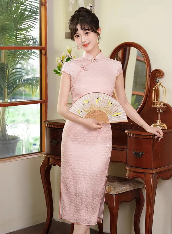 Woman in a traditional Pink Mulberry Silk Jacquard Qipao Dress  holding a fan in a room with wooden furniture and a window.
