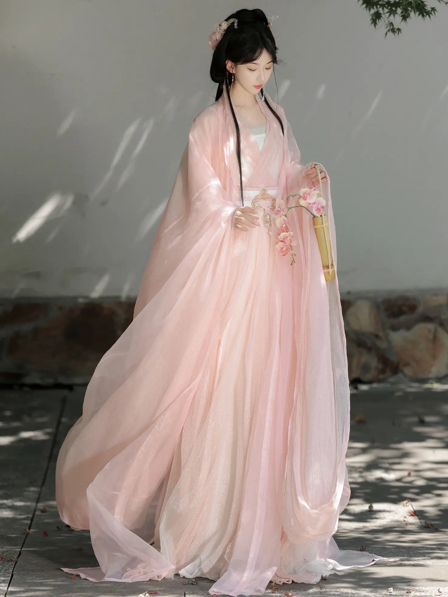Woman in a Pink Traditional Wei-Jin Style Double-Layer Hanfu Dress Set standing outdoors with a neutral background