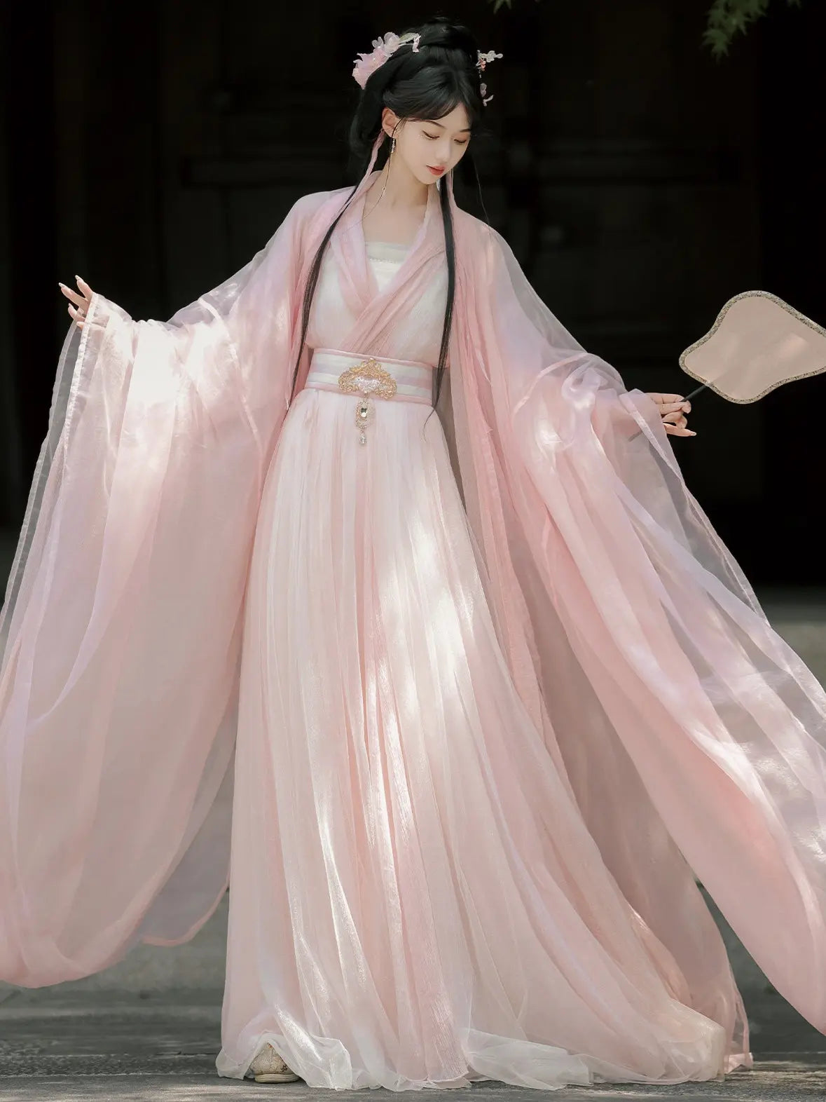 Person wearing a Pink Traditional Wei-Jin Style Double-Layer Hanfu Dress Set with flowing sleeves against a dark background