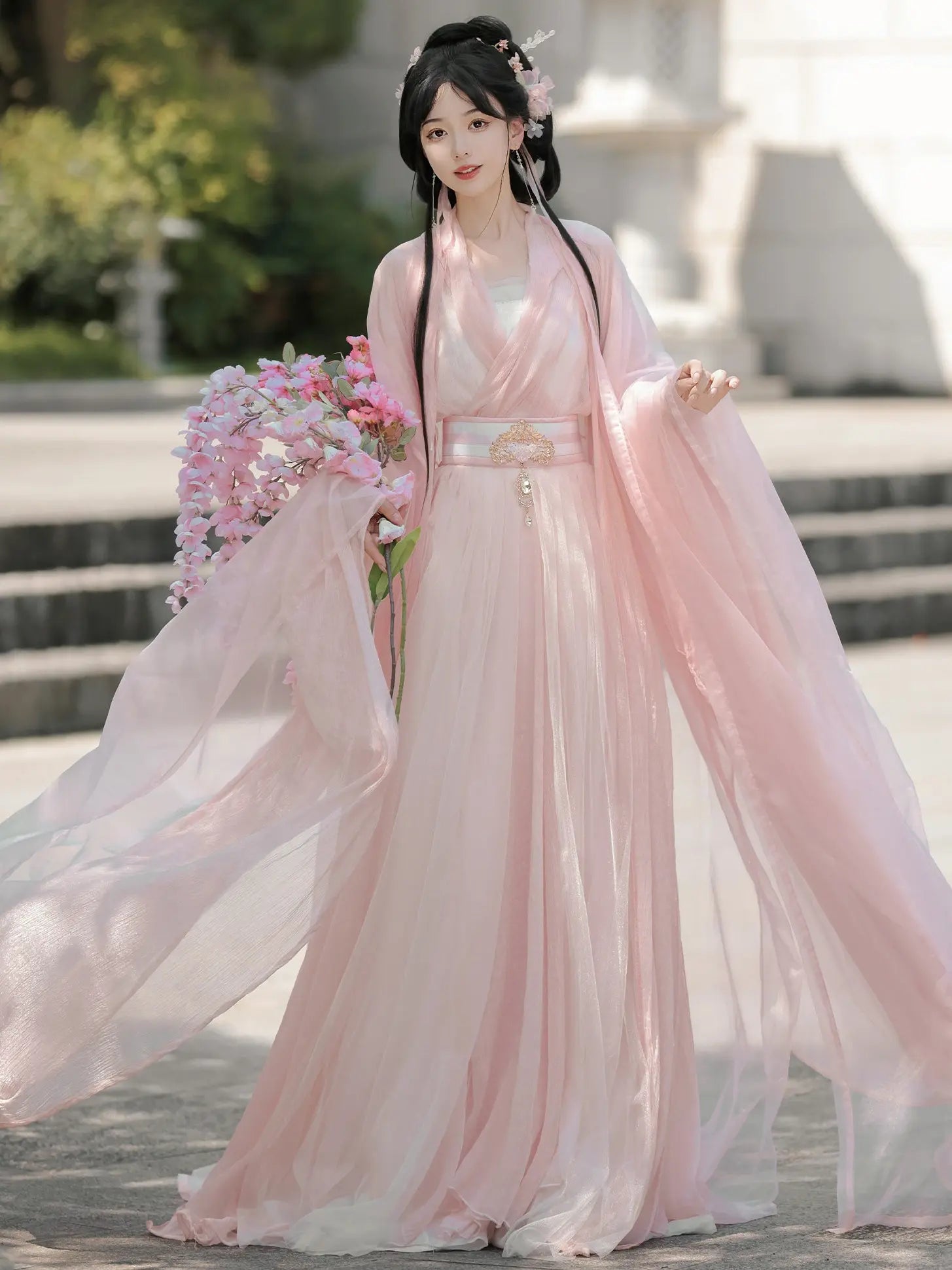 Woman in a Pink Traditional Wei-Jin Style Double-Layer Hanfu Dress Set holding flowers outdoors