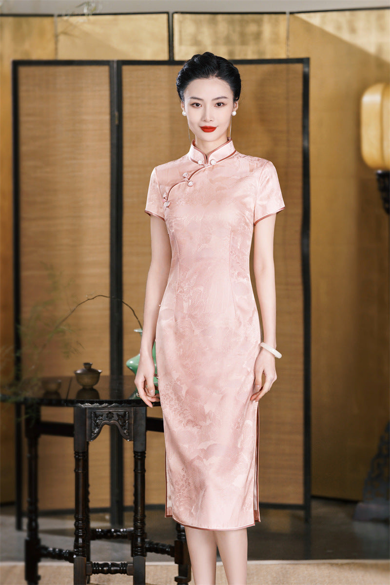 a chinese girl in short sleeves pink silk qipao dress standing
