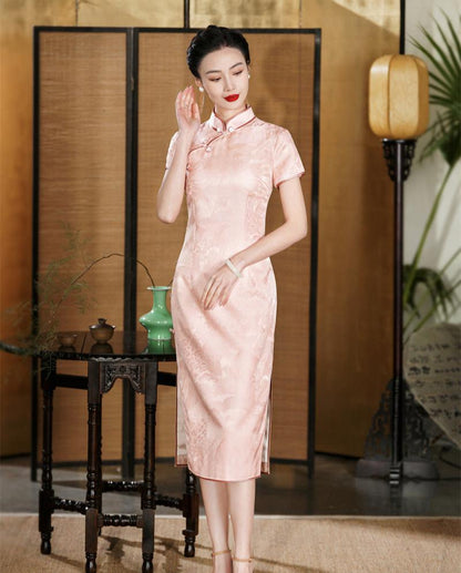 a chinese girl in short sleeves pink silk cheongsam dress