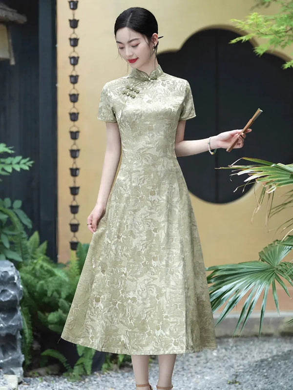 A woman wearing a short-sleeved, Pistachio Sage Green Floral Jacquard Modern A Line Qipao  cheongsam dress with a subtle floral jacquard pattern, standing in a garden courtyard.