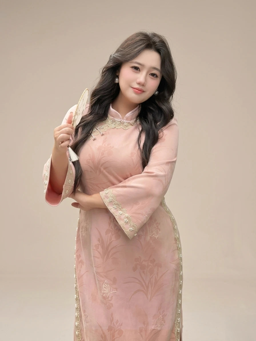 Woman in a Plus Size Long Sleeve Pink Floral Qipao with Pearl Trim  traditional chinese dress holding a hairbrush against a beige background