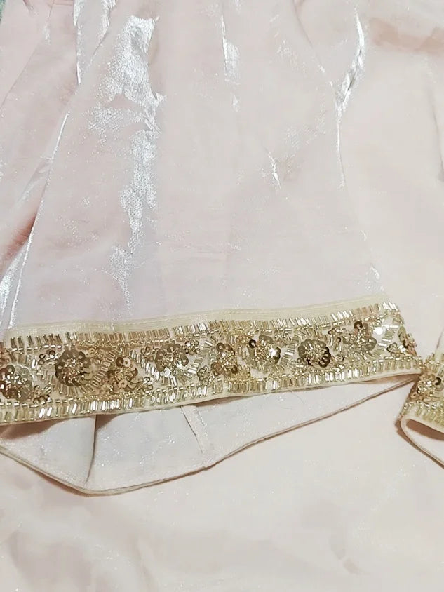 Decorative gold ribbon with intricate patterns on a clear background