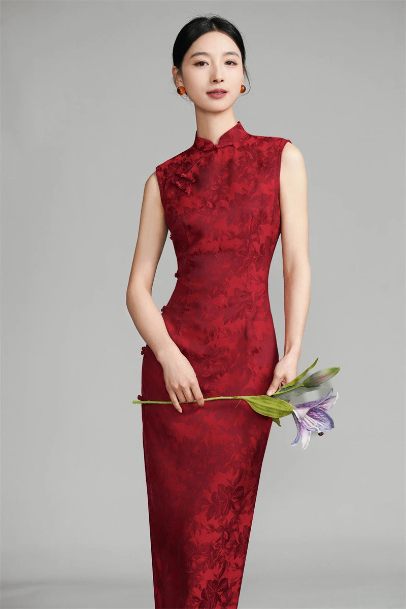 Woman wearing a Red Sleeveless Floral Jacquard Chinese Cheongsam Qipao Dress  holding flowers against a gray background
