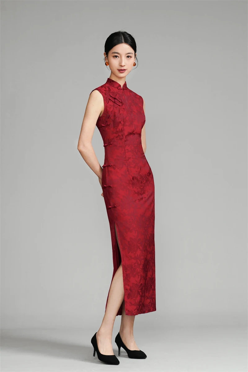 Woman wearing a red modern cheongsam with a gray background