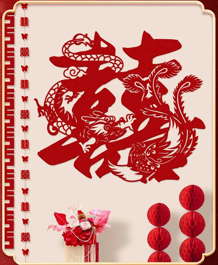 Decorative red cutout with dragon and pheonix and Chinese double happinese characters on a beige wall background