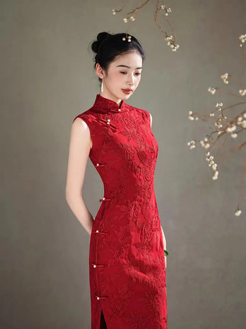 Woman wearing a  traditional Red Floral Embroidery Sleeveless Qipao dress against a neutral background