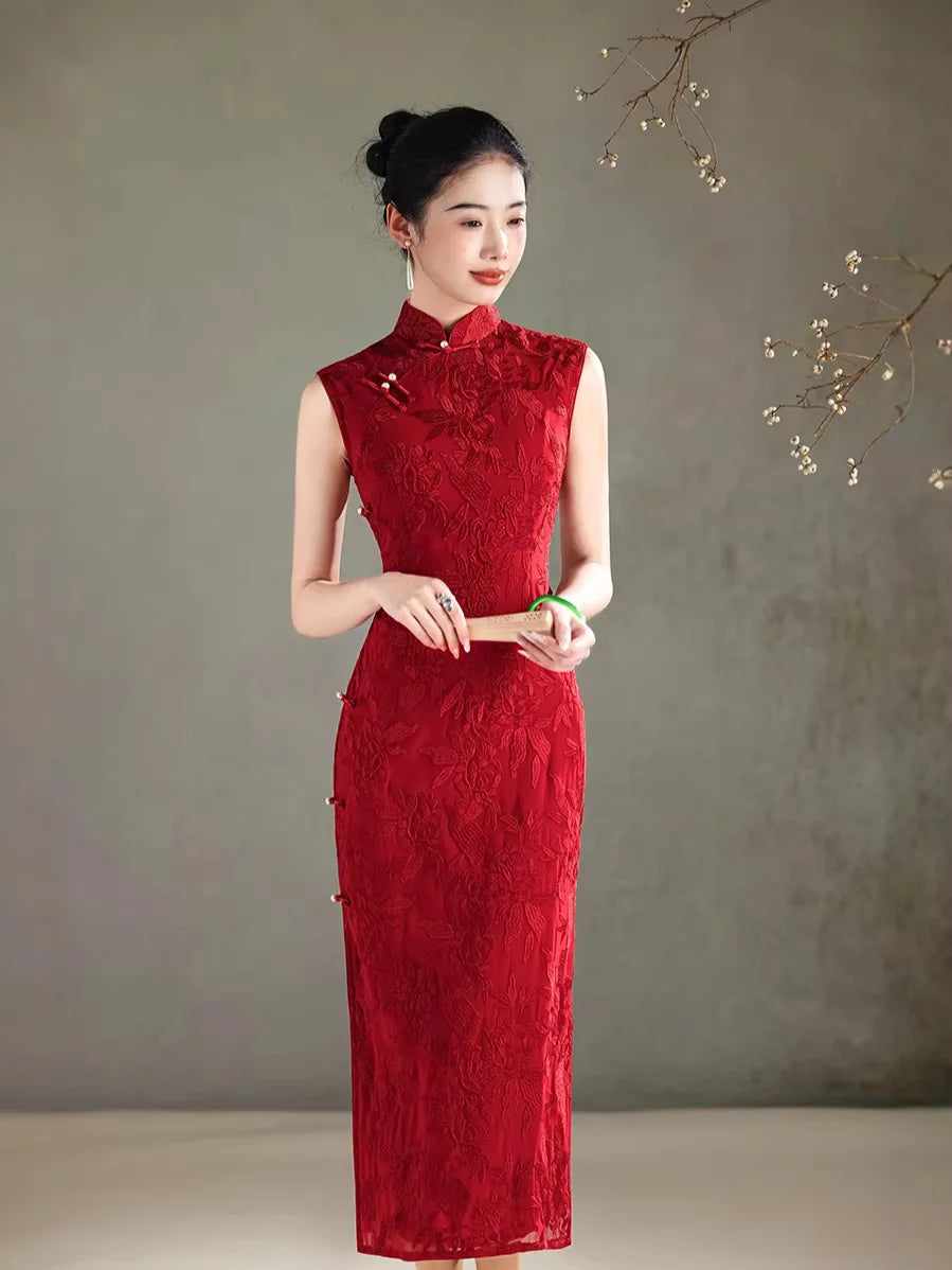 Woman wearing a red lace Floral Embroidery Sleeveless Qipao dress against a plain background