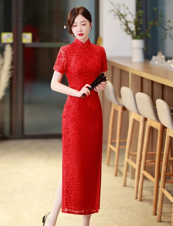 Woman in a Red Floral Lace Midi Qipao Cheongsam Dress standing in a modern indoor setting with wooden furniture.