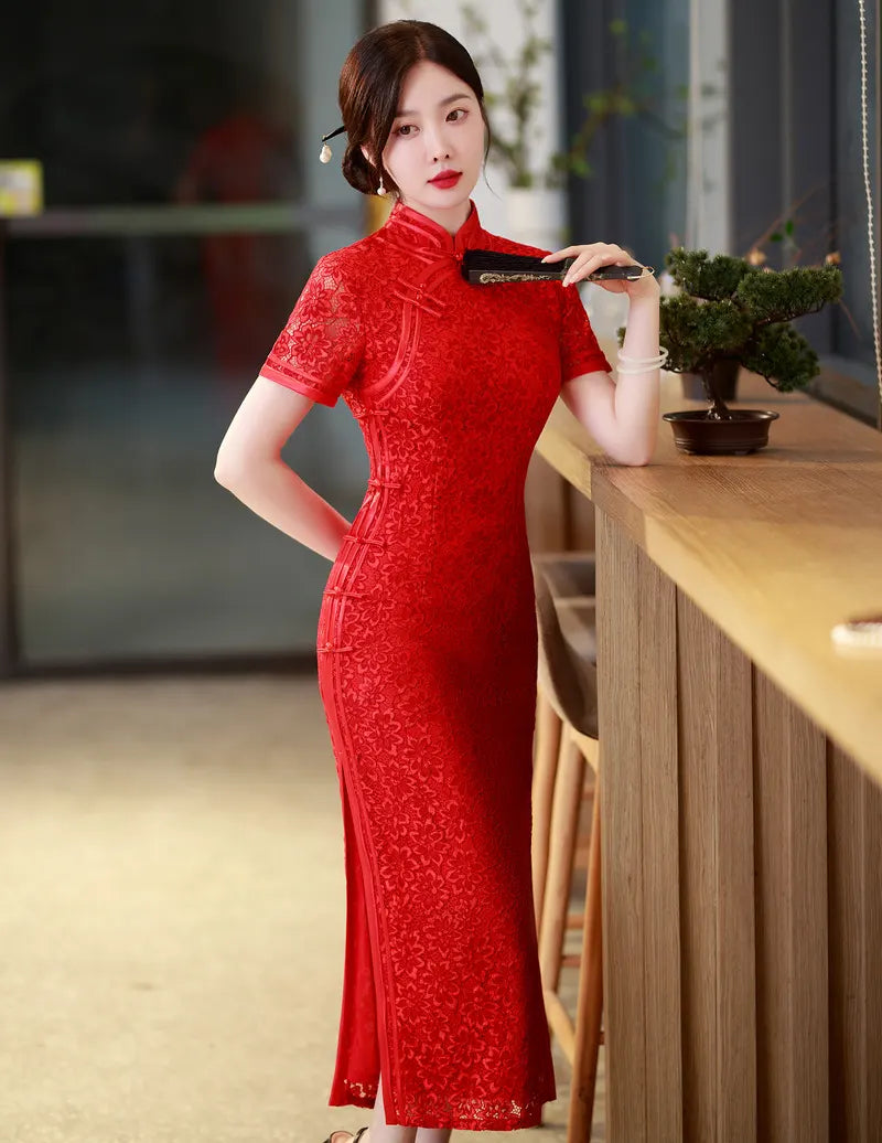 Woman in a Red Floral Lace Midi Qipao Cheongsam Dress  standing in an indoor setting with a blurred background