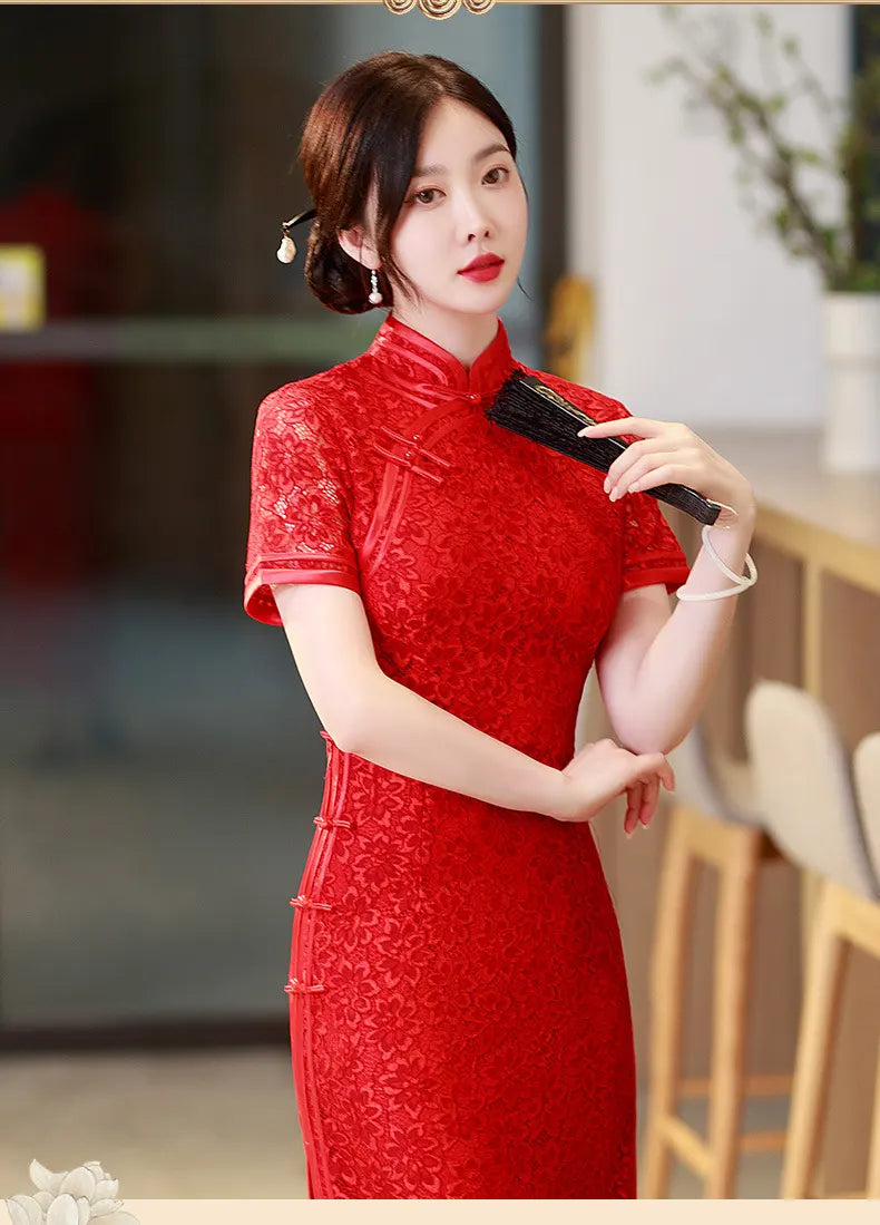Woman in a Red Floral Lace Midi Qipao Cheongsam Dress holding a black hairbrush indoors.