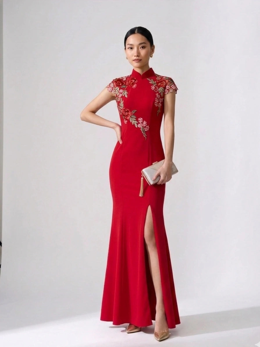 Woman wearing a Red Floral Thigh-High Slit Floor Length Mermaid Qipao cheongsam Chinese bridal gown with floral embroidery on a white background