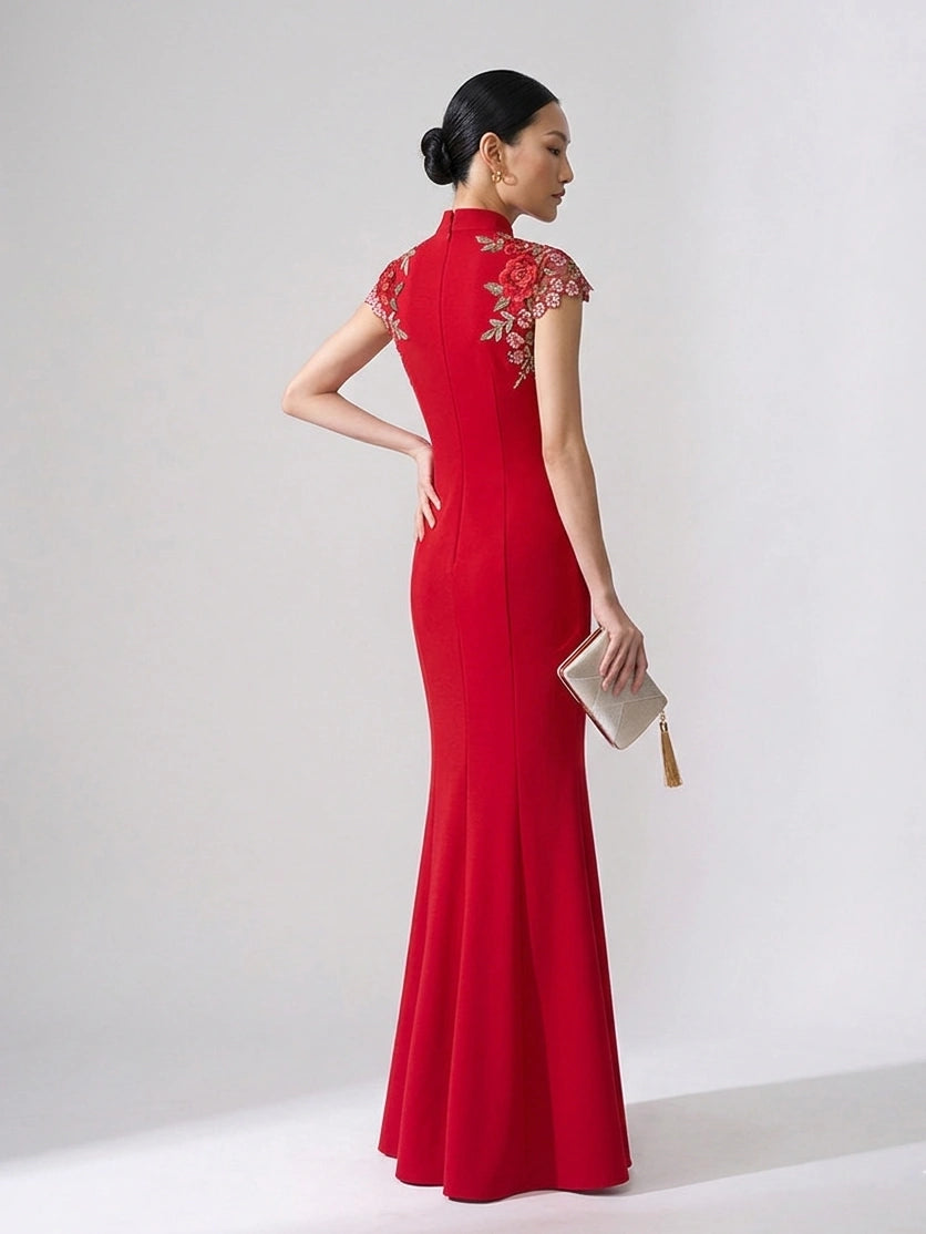 Woman wearing a Red Floral Thigh-High Slit Floor Length Mermaid Qipao Dress   evening gown with floral embellishments on a white background