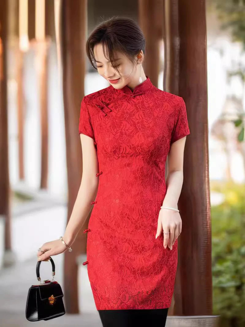 Woman wearing a Red Lace Midi Length Short Sleeves Qi pao Dress holding a black handbag outdoors.