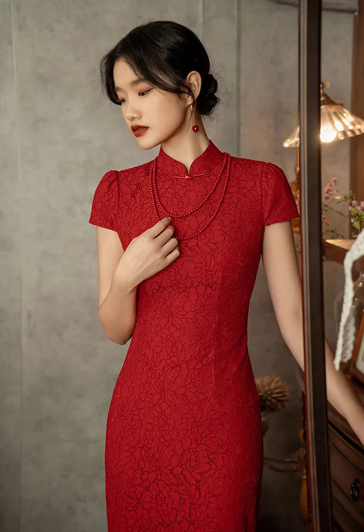 Woman wearing a Red Lace Open Back qi pao Wedding Dress against a neutral background
