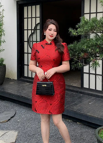 Woman in a Red Plus Size Modern Rose Jacquard new chinese style Qipao holding a black handbag in front of a building entrance.