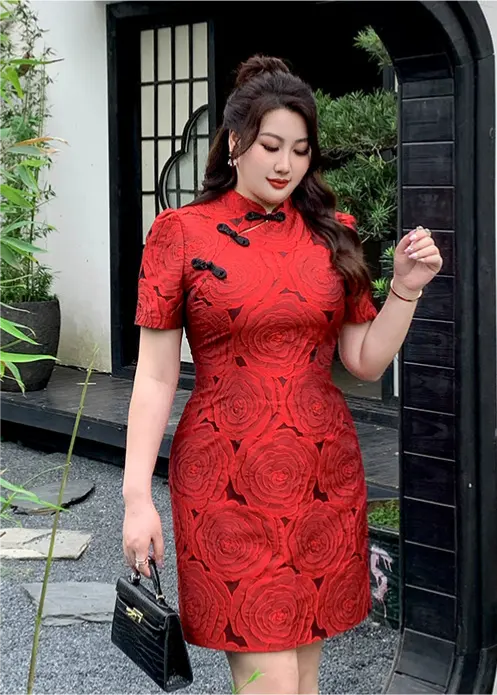 Woman wearing a Red Plus Size Modern Rose Jacquard Qipao Cheongsam dress with black details outdoors.