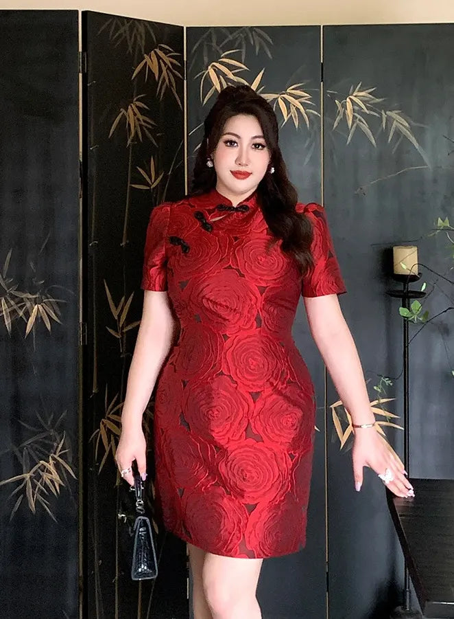 Woman in a Red Plus Size Modern Rose Jacquard Qipao  dress standing in front of a black screen with bamboo designs.