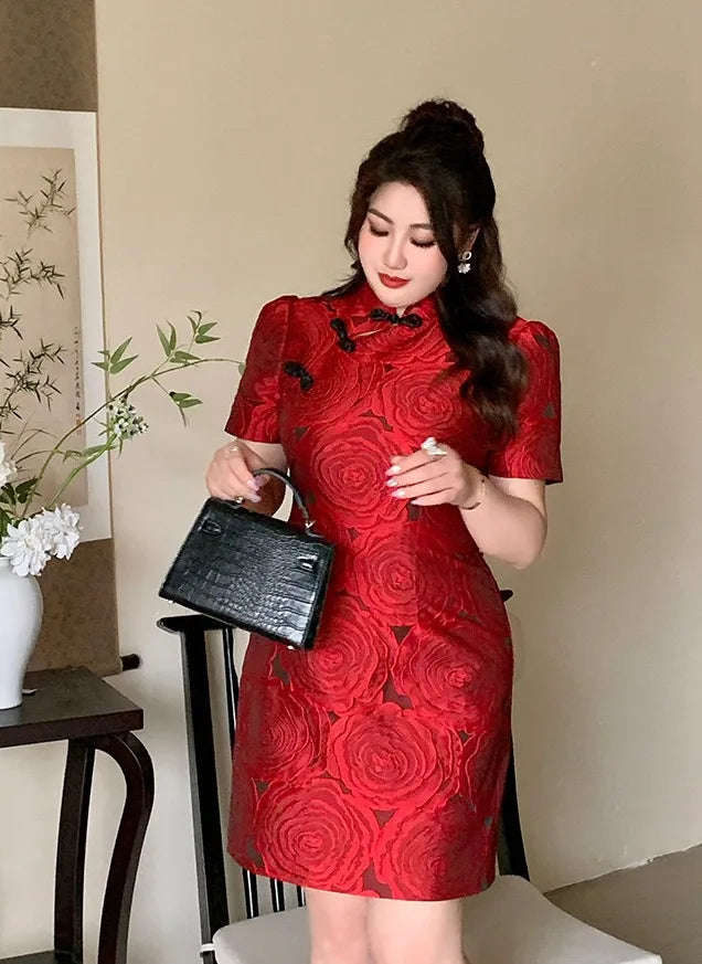 Woman wearing a Red Plus Size Modern Rose Jacquard Qipao  dress holding a black clutch in an indoor setting.