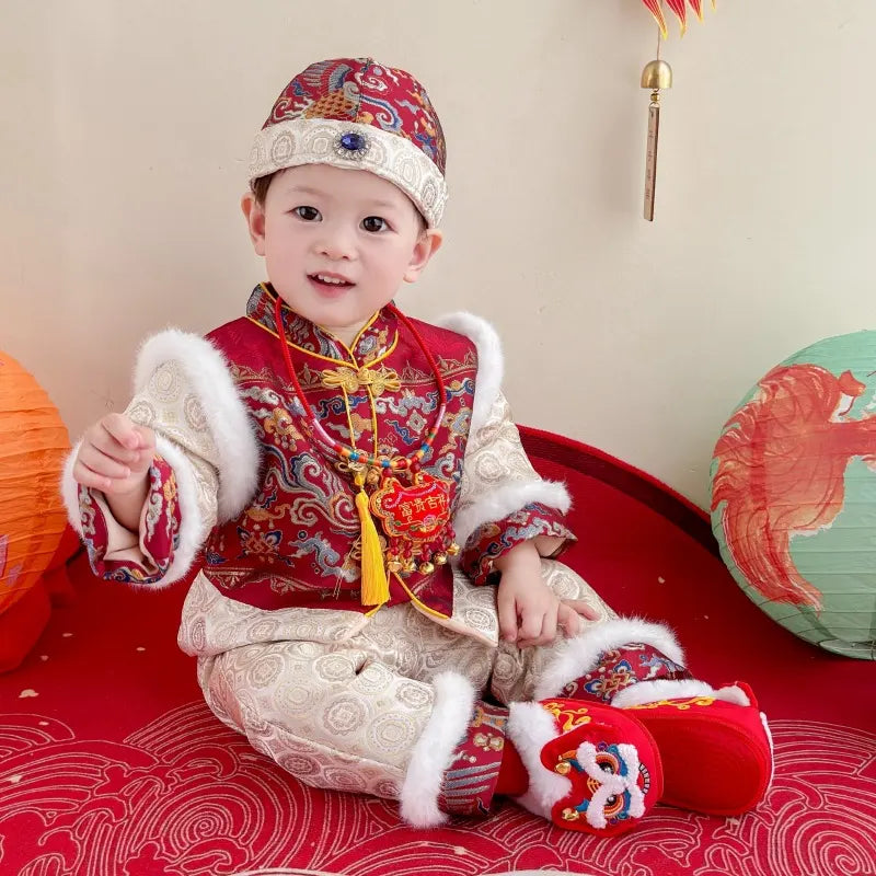 Child in traditional Chinese Red Quilted Baby Winter Tang Suit Set outfit with festive decorations