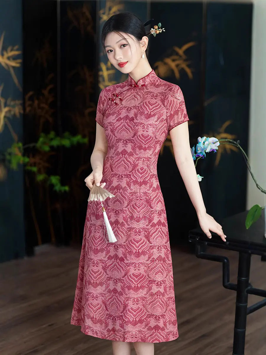 Woman wearing a Red Short Sleeves patterned  A-Line Qipao Cheongsam Dress holding a white fan indoors.