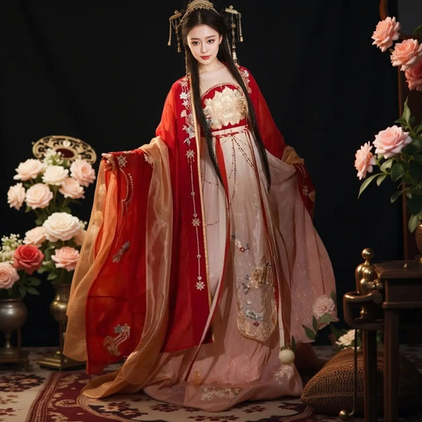 Woman in traditionalRed and Gold Tang Dynasty Traditional Chiness Hanfu Dress with floral decorations, surrounded by flowers and classical furniture.