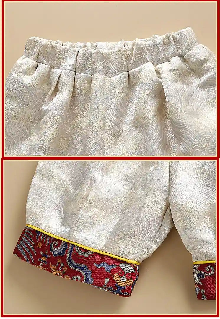 White fabric with red and blue patterned trim on a beige background
