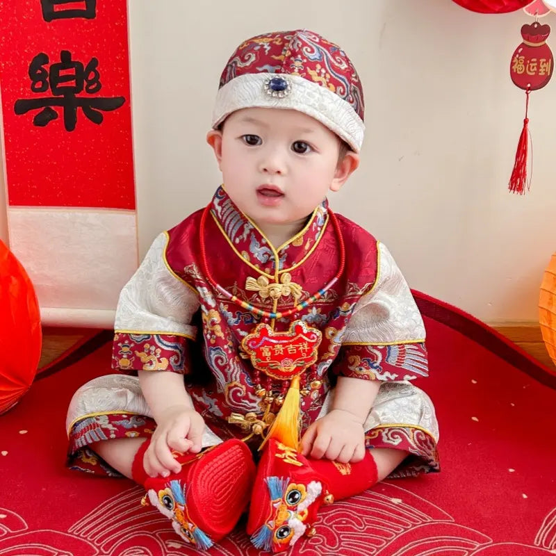 Baby in Traditional Chinese Red Short Sleeves Baby Tang Jacket Set with festive decorations
