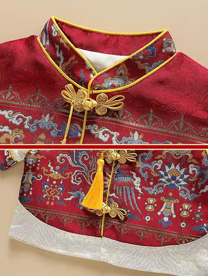 Traditional red garment with intricate patterns and gold accents on a beige background