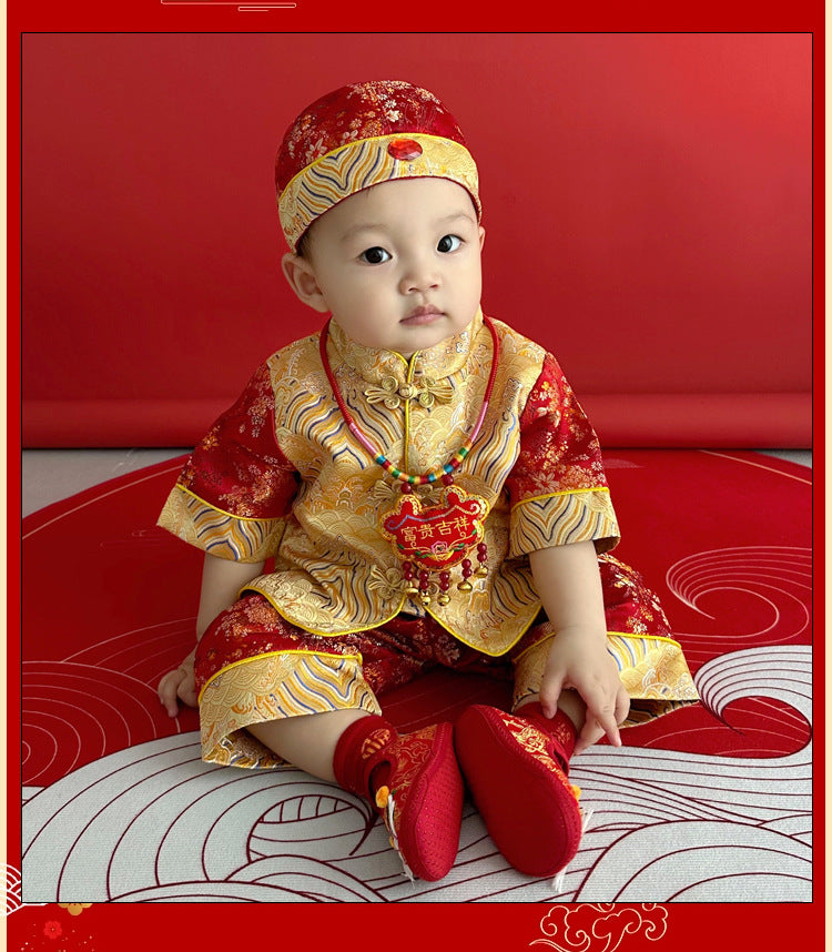 A chinese baby in short sleeves Red and Golden Tang Jacket top and pants and Traditional Hat