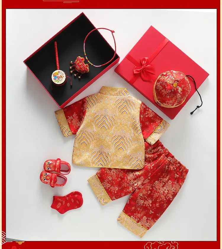 Traditional Chinese outfit with gold and red elements on a white background