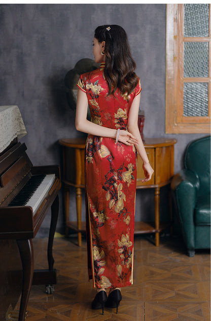 a chinese girl in red long floral silk qipao back