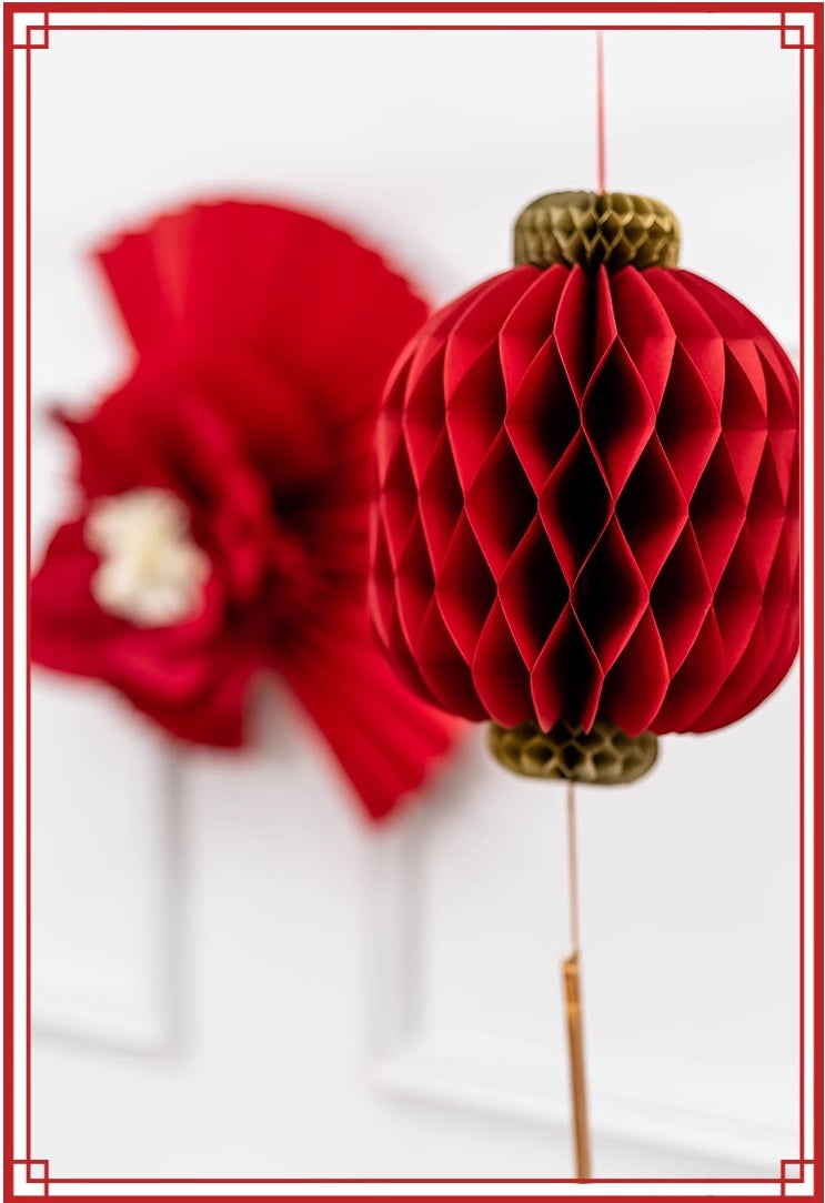  red honeycomb lantern with gold tassel, perfect for festive occasions like Chinese New Year or weddings